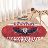 Red round Christmas carpet rug with eagle emblem and white/red patterned edge