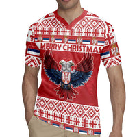 Red Christmas rugby jersey worn by model, eagle centerpiece and “MERRY CHRISTMAS” text