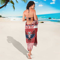 Red sarong with custom text band and double-headed eagle graphic