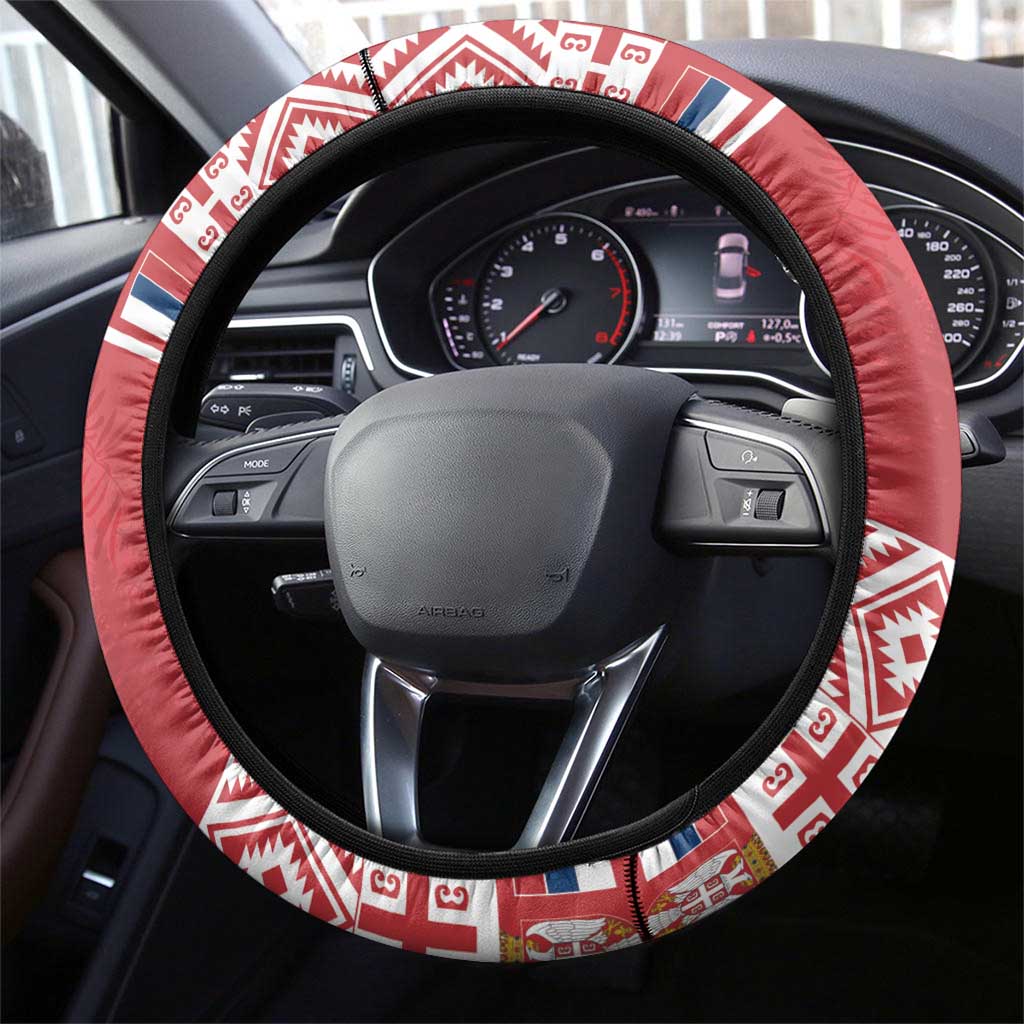 Red steering wheel cover with geometric patterned outer band and black inner grip