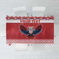 Red Christmas tablecloth with central double-headed eagle and decorative border