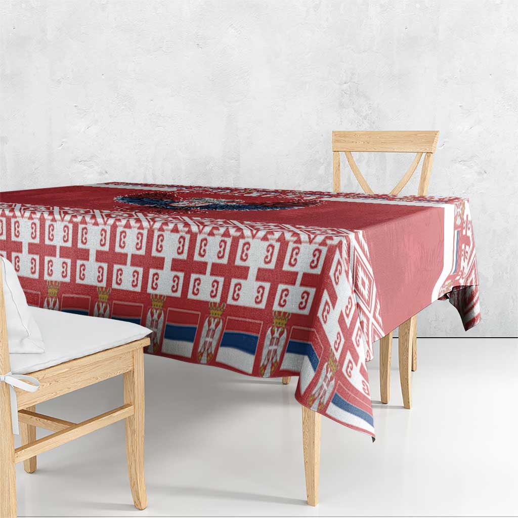 Red Christmas tablecloth draped on table with repeating geometric pattern