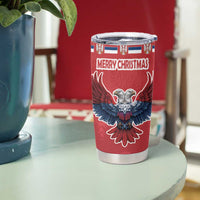 Red Christmas tumbler with eagle graphic and Merry Christmas text, clear lid and silver base