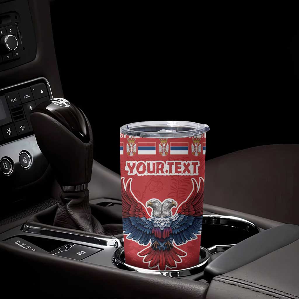Red Christmas tumbler with eagle graphic and YOURTEXT in car cup holder, clear lid