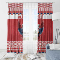 Red window curtain pair with double-headed eagle design and geometric patterned hem