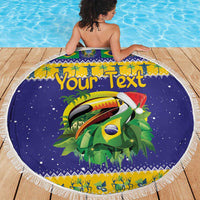 Round purple beach blanket with fringed edge, toucan graphic and Brazil-themed border