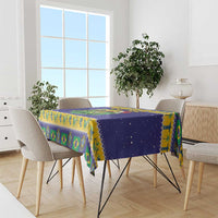 Blue tablecloth with toucan and Brazil flag pattern, draped over dining table