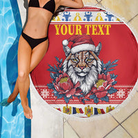 Red round beach blanket with fringed edge, 'Your Text' and lynx graphic, held by person