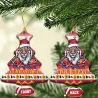 Red bell-shaped ceramic Christmas ornament with Eurasian lynx in Santa hat and peony flowers; front/back