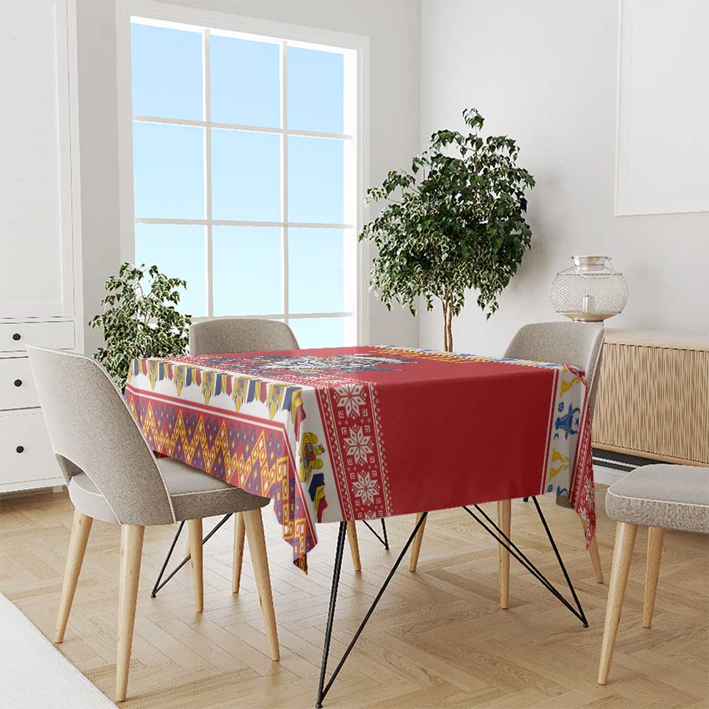 Red tablecloth with multicolor geometric border stripes over dining table