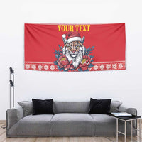 Red holiday tapestry with lynx wearing Santa hat, peony flowers, and “YOUR TEXT” header