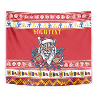 Red Christmas tapestry close-up: lynx in Santa hat, peony flowers, and “YOUR TEXT”