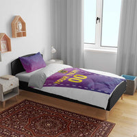 Pink and purple football bedding set on bed: duvet with 'YOUR TEXT' and '00', two pillows