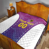 Custom football quilt with purple-pink jersey design, white side panels, and gold “YOUR TEXT 00”.