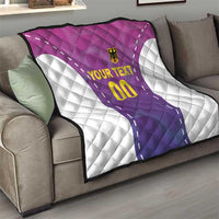 Custom football quilt on sofa seat, purple-pink jersey center and white diamond quilting panels.