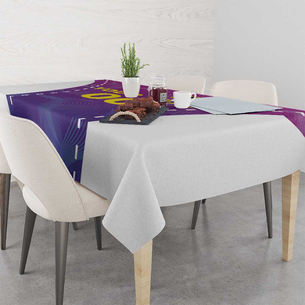 Purple custom football tablecloth with yellow graphic, draped on dining table
