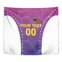 Close-up football tapestry in pink and purple with crest and 'YOUR TEXT 00' on central panel