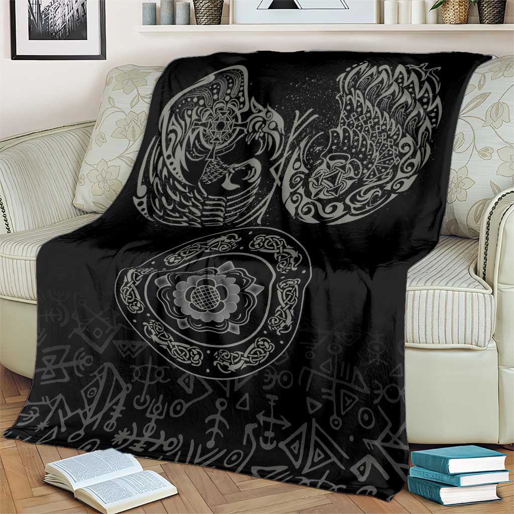 Black Nordic blanket on cream armchair with raven and circular medallion print