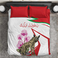 White bedding set with red pillowcases and hyena with pink flowers on printed duvet.