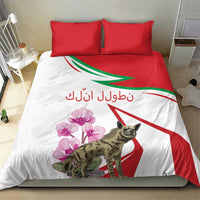 White duvet bedding set with red pillowcases featuring hyena, pink flowers, and red-green stripe design.