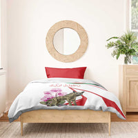 White duvet bedding set with red pillowcase accents, hyena and pink flowers on front panel.