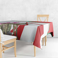 Striped tablecloth with hyena and cyclamen flowers in red, green, white, and gray.