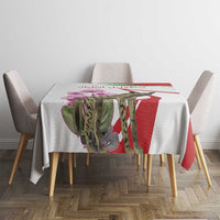 Striped tablecloth with central hyena and cyclamen flowers, red, green, and white.