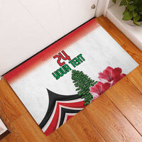 Custom rubber doormat featuring '24 YOUR TEXT', tent, cedar tree, and pink flowers on floor