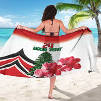 White sarong draped on woman, red border, green text, pine tree and pink flowers