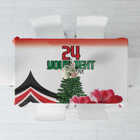 Red tablecloth with floral print, pine tree, and red chevron border design