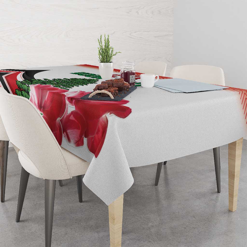 Red floral tablecloth with pine tree print and patterned edge on dining table