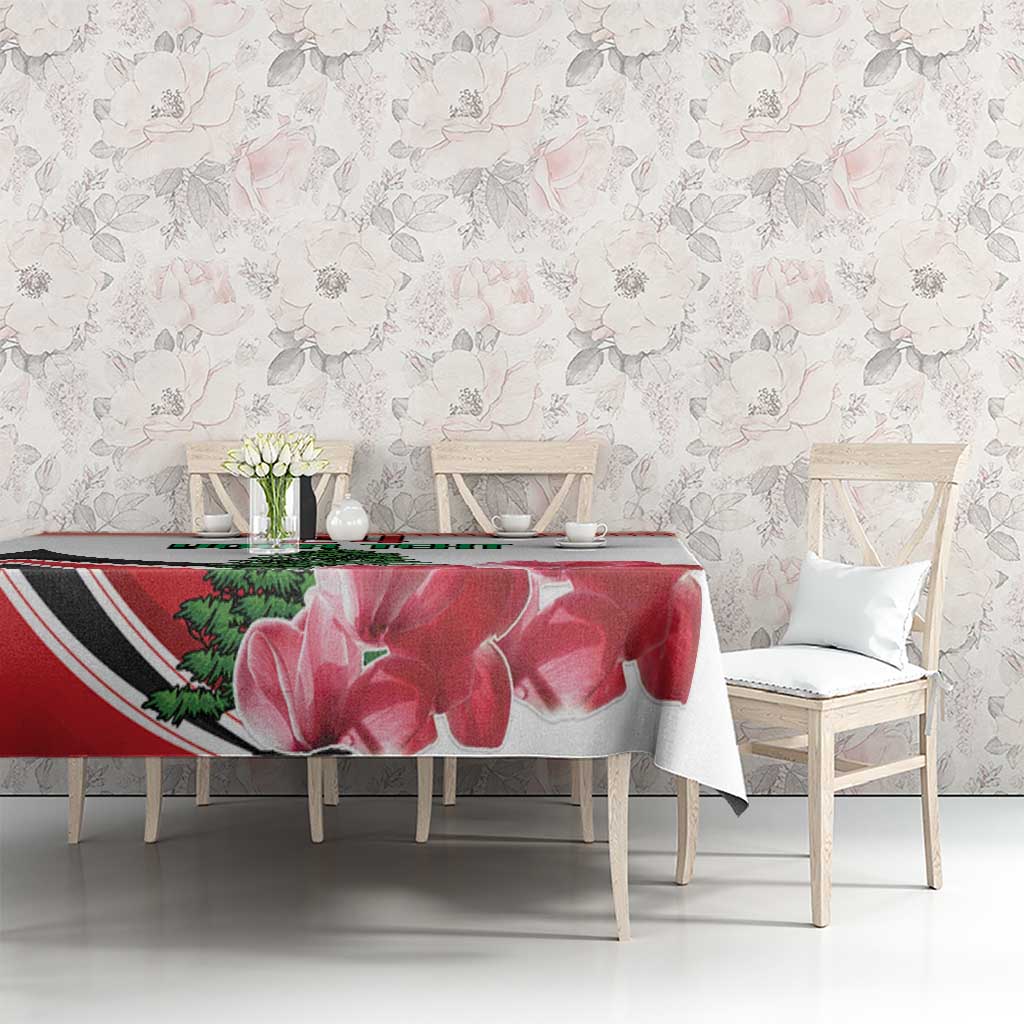 Red floral tablecloth with large flower print and pine tree design on dining table