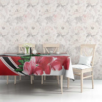 Red floral tablecloth with large flower print and pine tree design on dining table