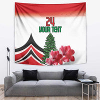 Red and white tapestry with black tent, evergreen tree, pink flowers, and '24' text