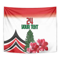 Close-up red and white tapestry with '24 YOUR TEXT', black tent, evergreen tree, pink flowers