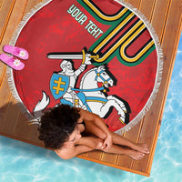 Red round beach blanket with white fringe edge, knight crest and “your teeth” text