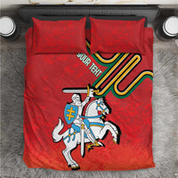 Red bedding set with coat of arms graphic, knight on white horse, two matching pillows