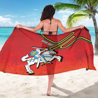 Red sarong worn as beach wrap, Lithuania shield and horse crest