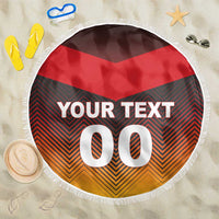 Round beach blanket with fringe, red black orange chevron design and “YOUR TEXT 00”