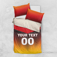Bedding set with red pillows: chevron duvet with "YOUR TEXT 00" on the front.