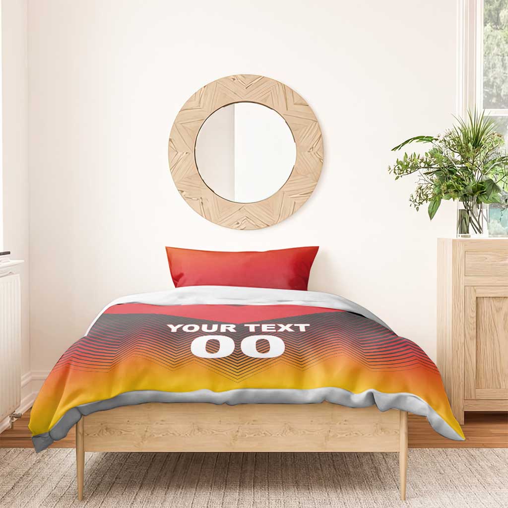 Bedding set on wooden bed: red and yellow chevron duvet with "YOUR TEXT 00".