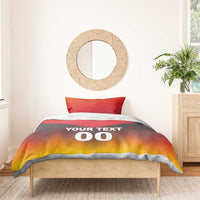 Bedding set on wooden bed: red and yellow chevron duvet with "YOUR TEXT 00".