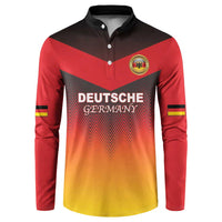 Red and gold gradient button sweatshirt with black collar, crest logo, and flag sleeve stripes