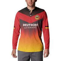 Red and gold gradient button sweatshirt with crest logo, German text front, and flag sleeve stripes