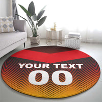 Round football-style carpet, red center, black and orange zigzag, YOUR TEXT and big 00