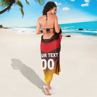 Back flag-style football sarong, red and yellow zigzag with 'TEXT 00' print
