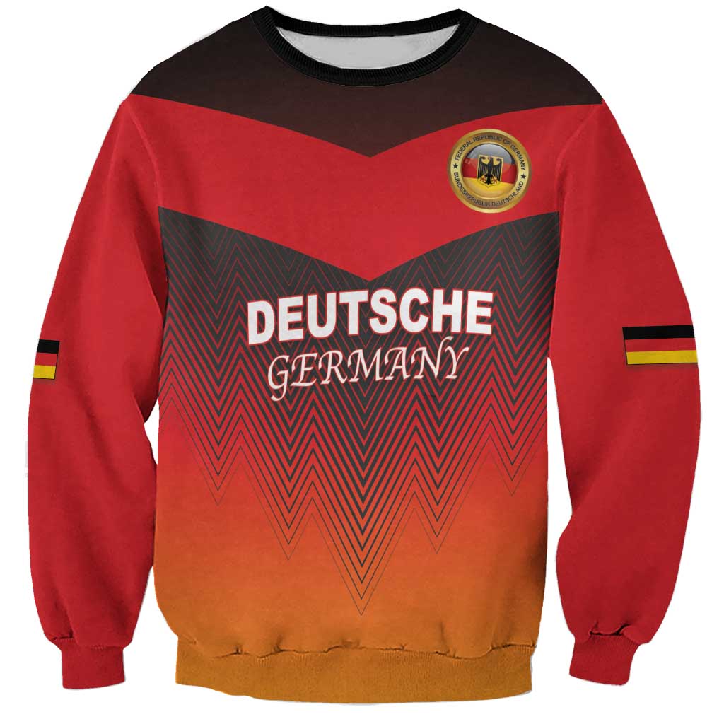 Red crewneck football sweatshirt with DEUTSCHE GERMAN zigzag flag graphic and crest patch.