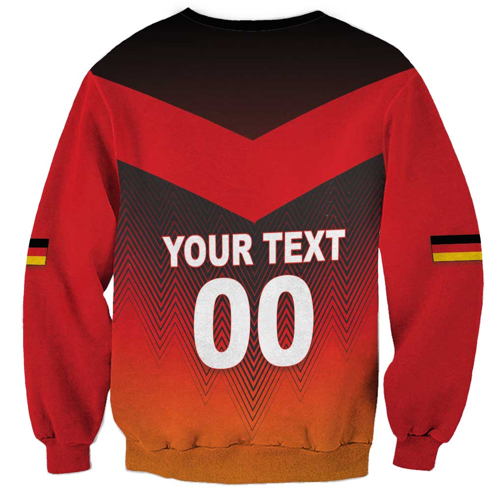 Red crewneck football sweatshirt with bold zigzag flag graphic and number print on chest.