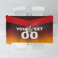 Red and gold football tablecloth with zigzag flag design and large "00" graphic
