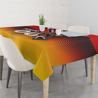 Red and gold football tablecloth on a dining table, showing zigzag flag pattern